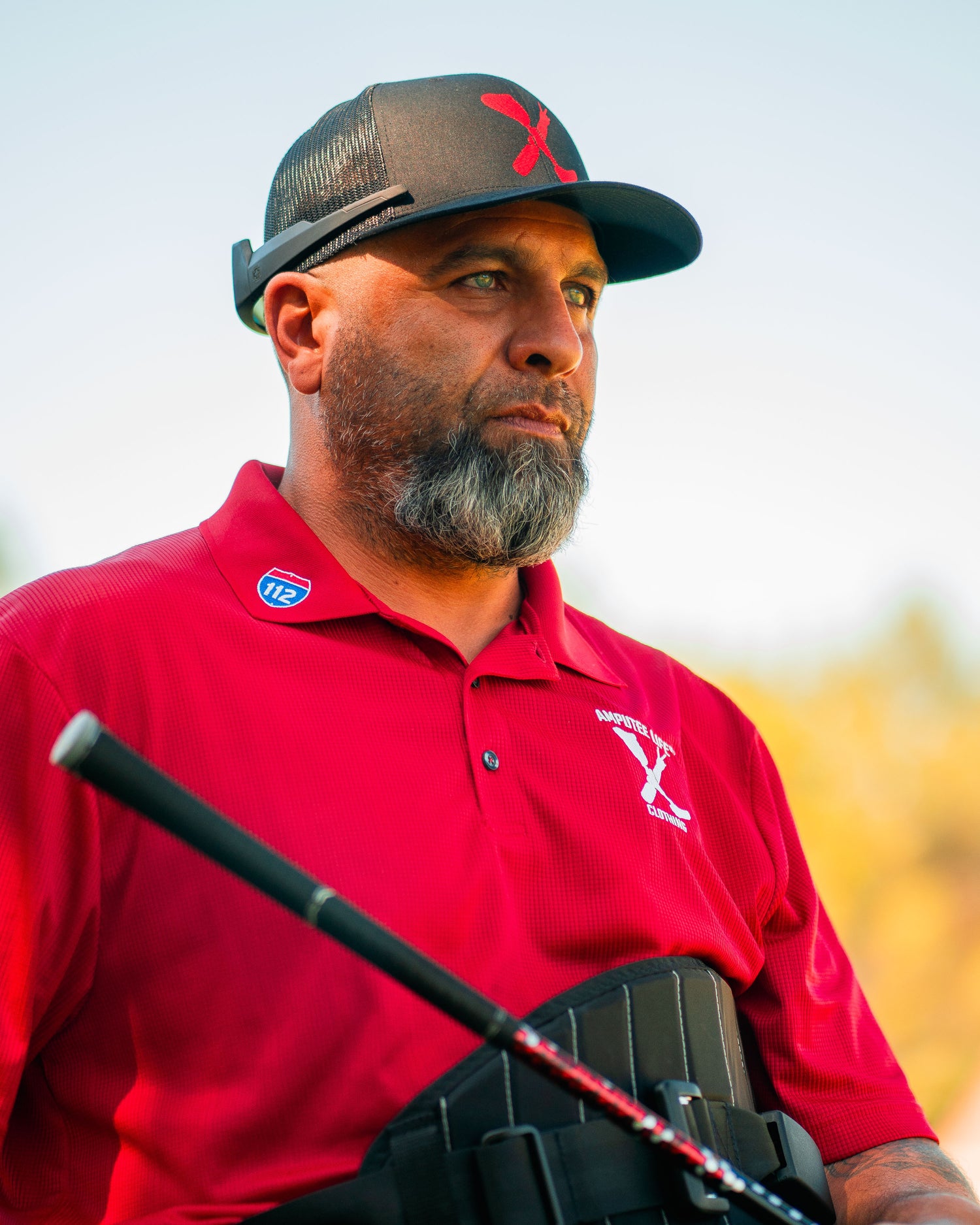 Portrait of Amplife® Foundation & Amplife® Founder Abdul Nevarez as he gets ready to hit his golf shot