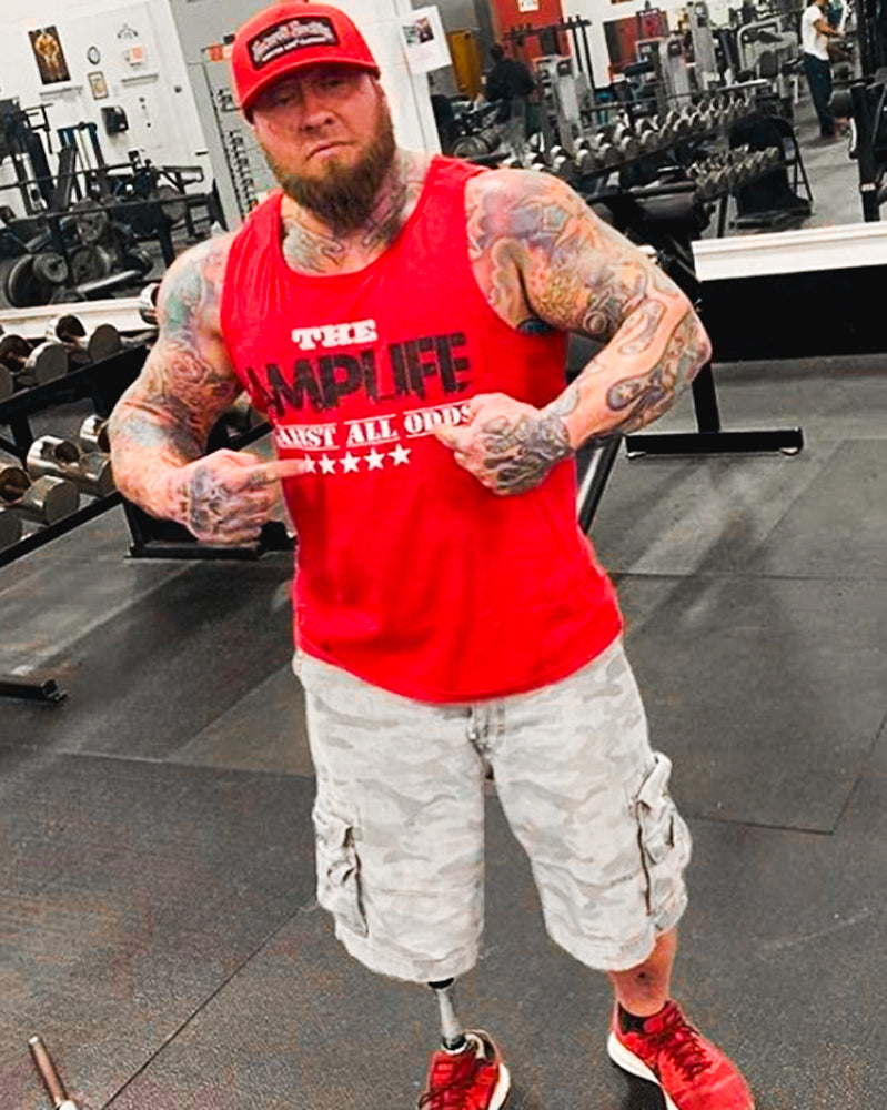 Portrait of an Amplife® Supporter rocking their red in the gym