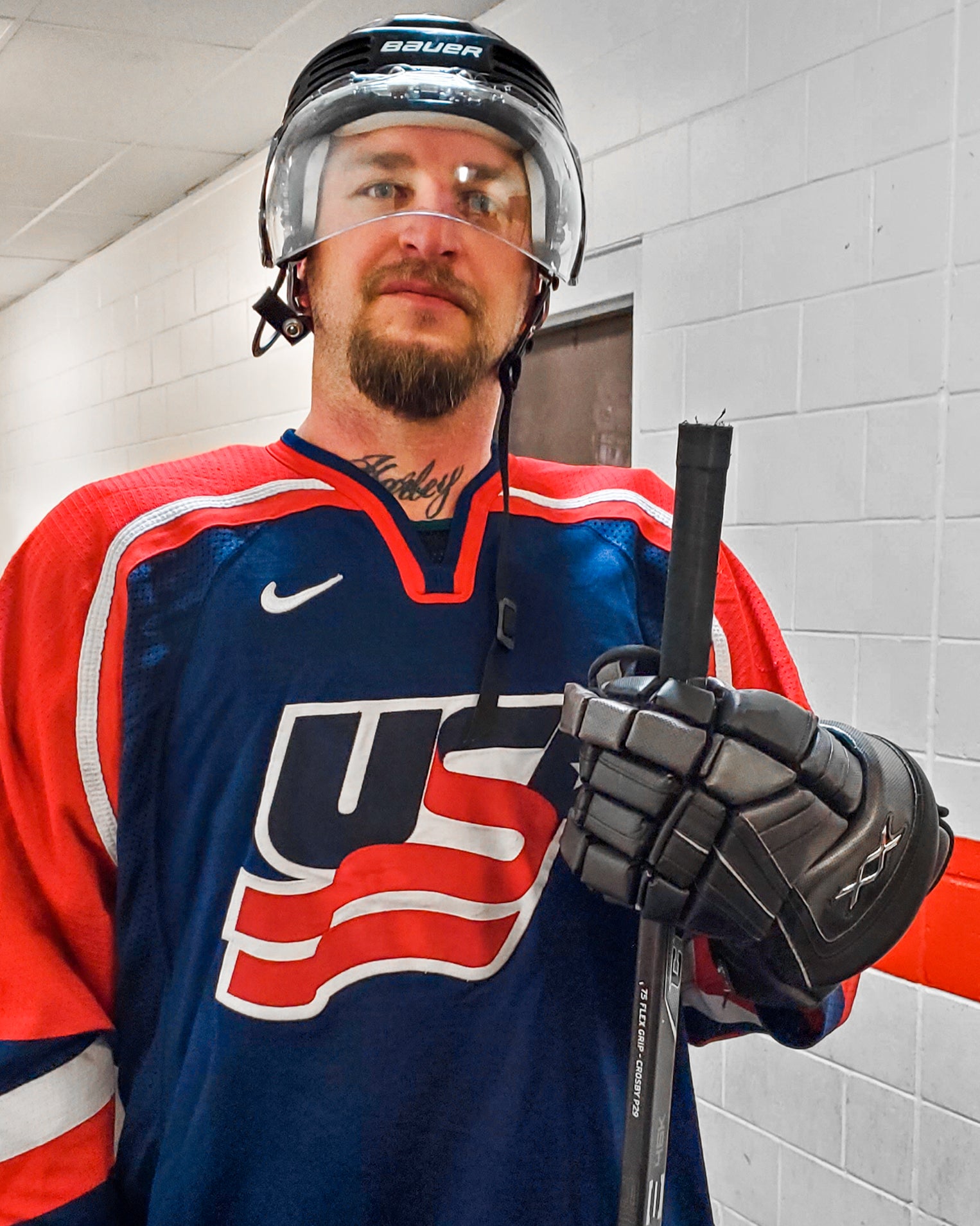 Team Amplife® Ambassador Cassidy Esty getting ready to play for the USA Stand-up Amputee Hockey Team