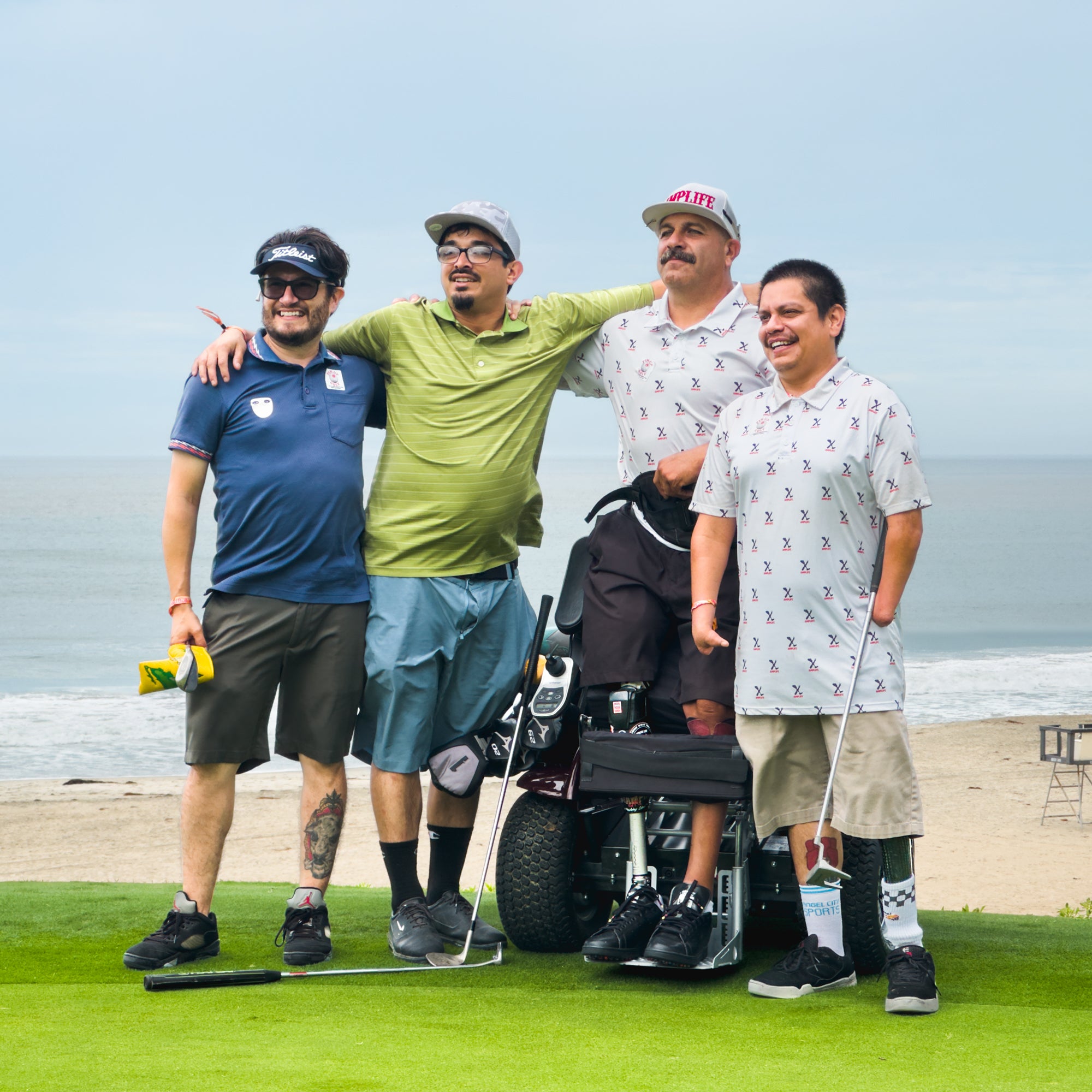Group photo of Amplife® Foundation & Amplife® Founder Abdul Nevarez with Team Amplife® Ambassador Oscar Loreto, Jr. and two Amplife® Supporters on a coastal golf course green