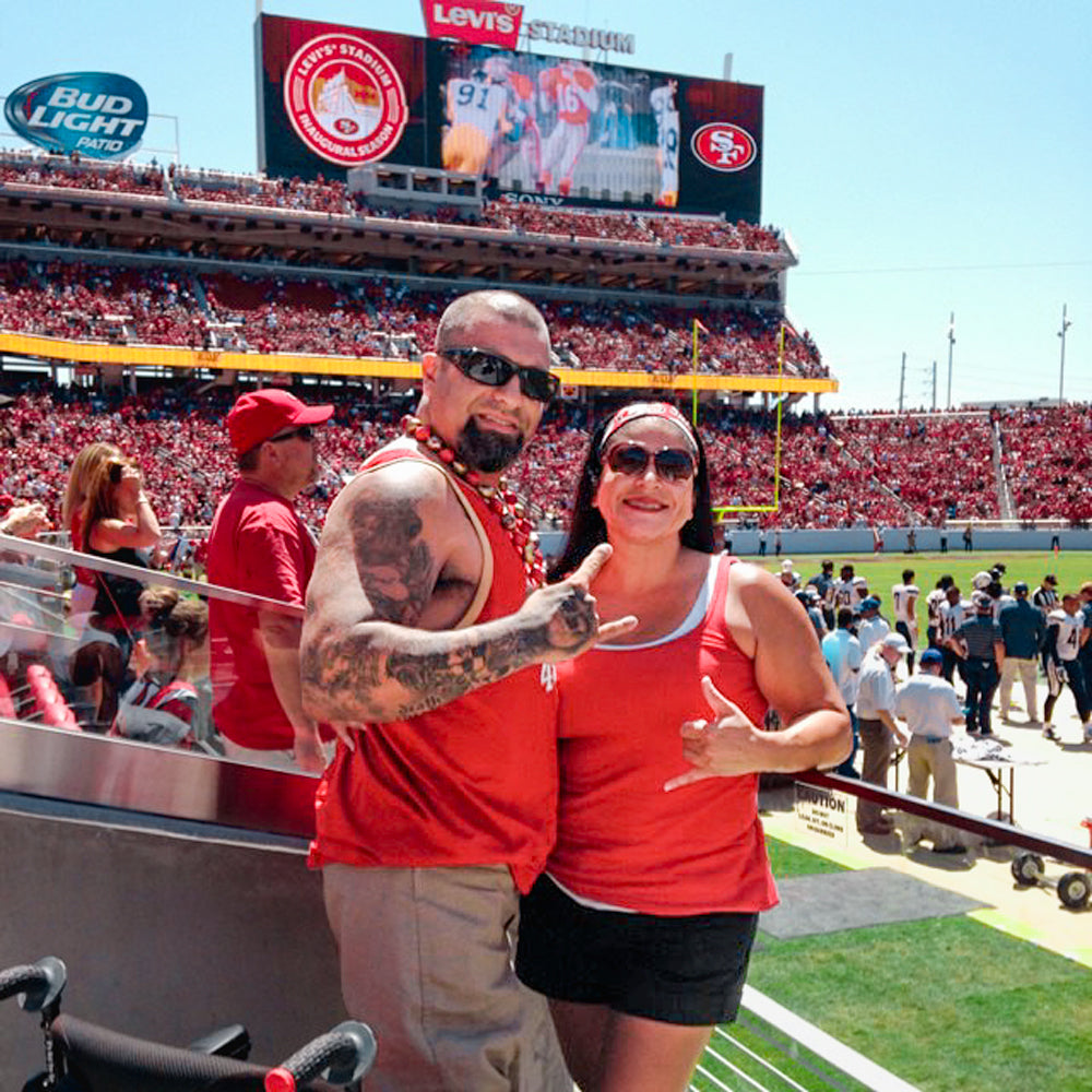 Portrait of Amplife® Foundation & Amplife® Founders Abdul Nevarez & Priscilla Nevarez at a inaugural 49ers game after Abdul joined the disabled community