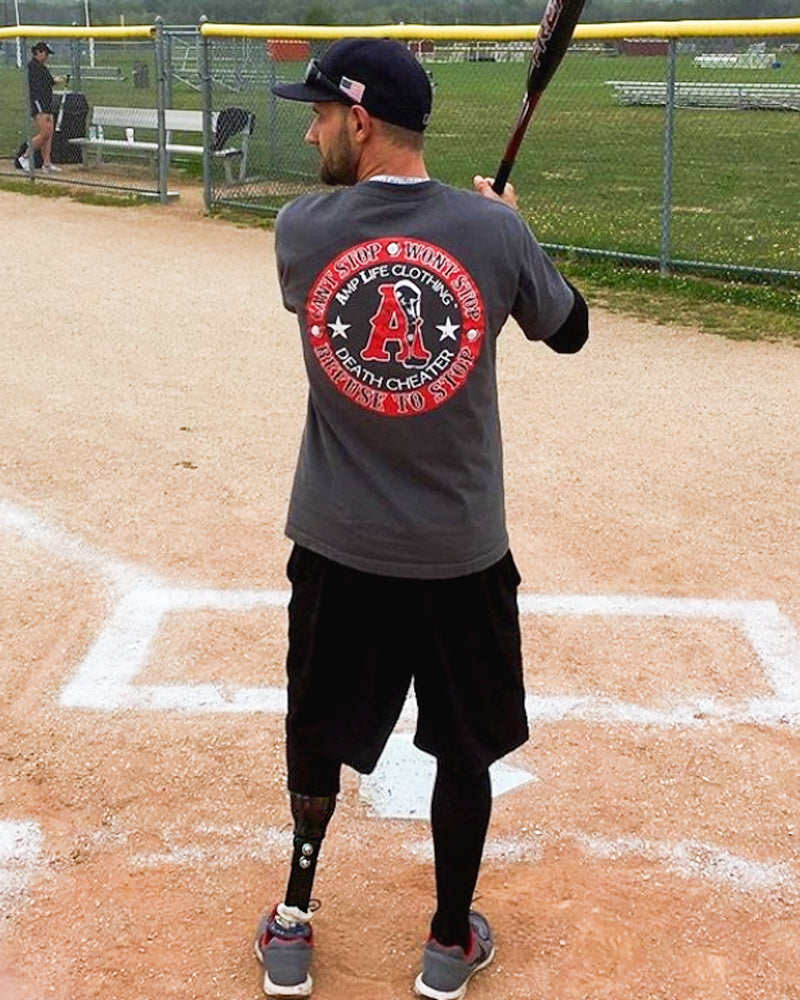 Amplife® Supporter standing at the plate ready to hit with their baseball bat