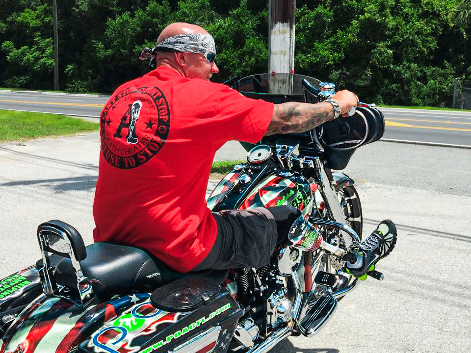 Portrait of Amplife® Love Cause 50 Legs Founder Steve Chamberland on his motorcycle