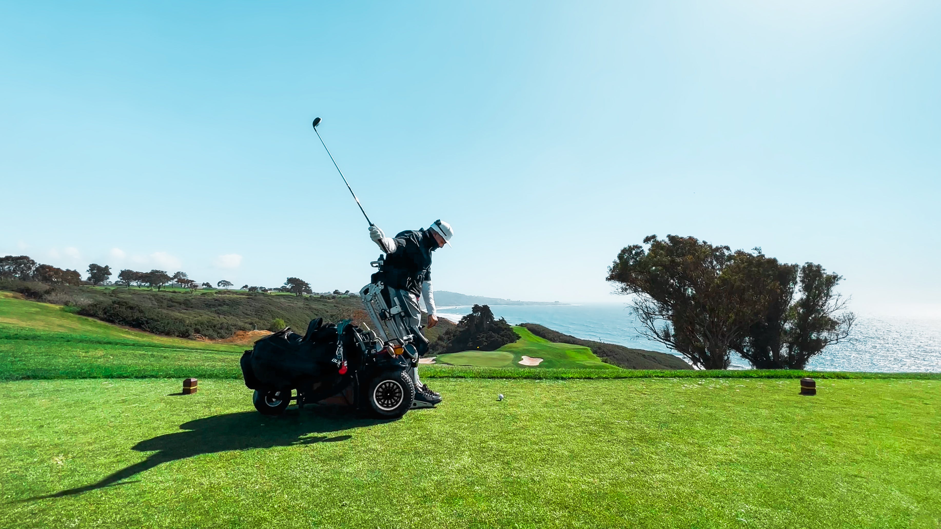 The backswing of Amplife® Foundation & Amplife® Founder Abdul Nevarez's 2nd one-armed hole-in-one as a right above knee amputee with severe nerve damage in his left arm and left leg in an adaptive golf cart at Torrey Pines North Course 15th